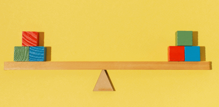 building blocks on a wooden scale